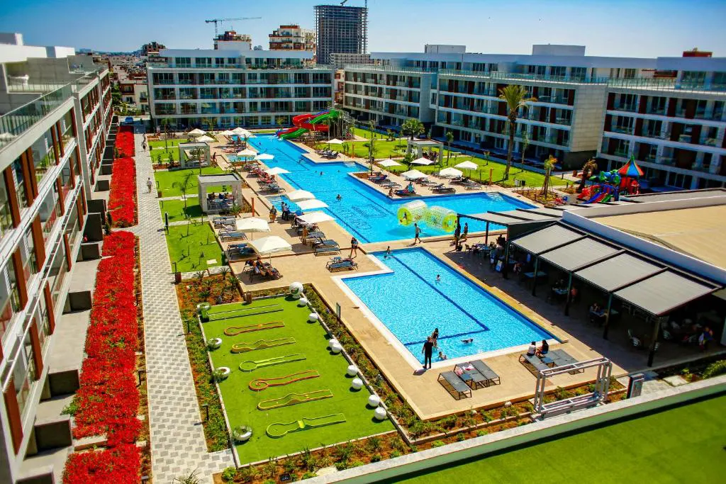 Private luxury taxi arriving at Courtyard Long Beach Holiday Resort, a 5-star beachfront resort on the Mediterranean coast of Famagusta, North Cyprus