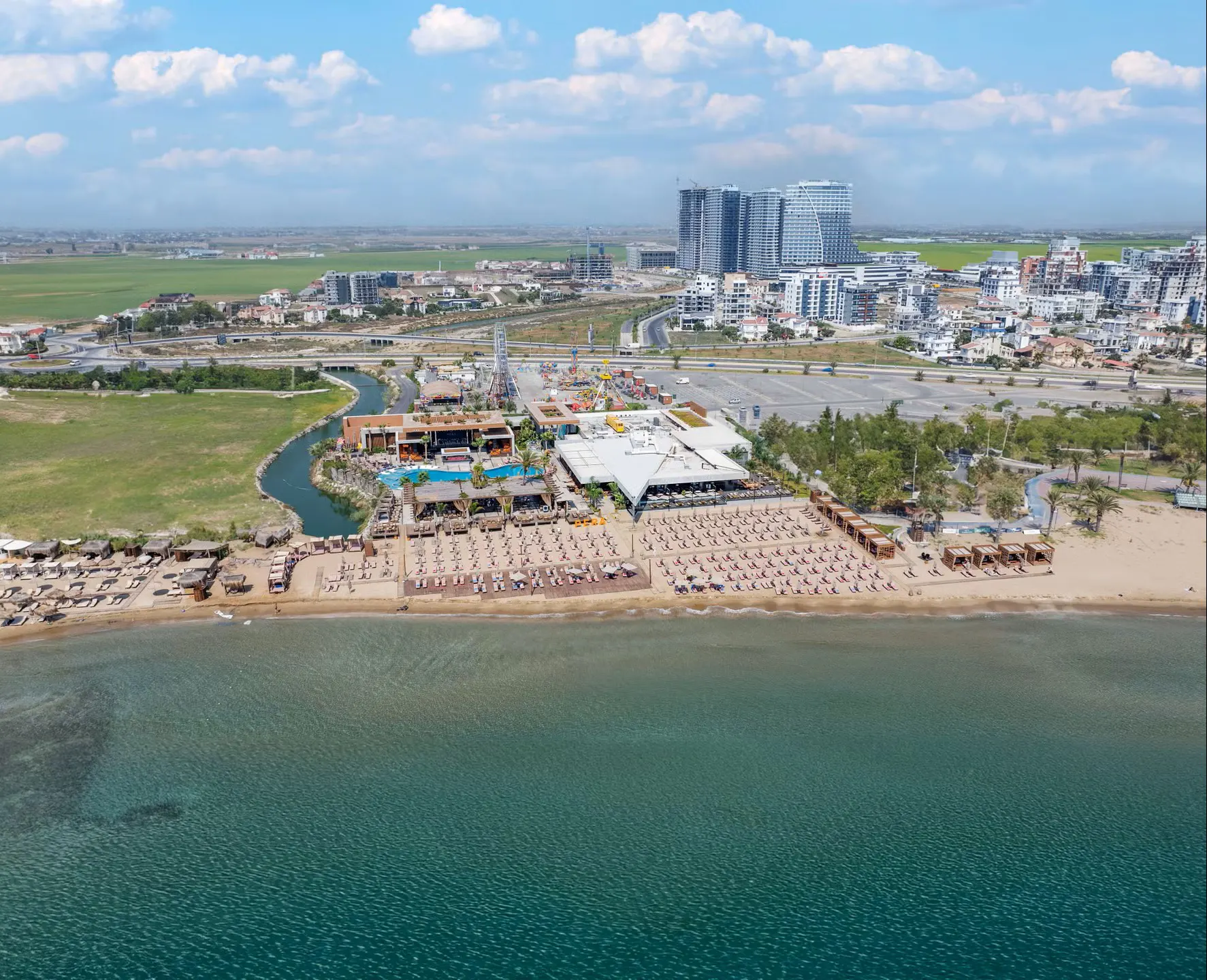 Private luxury taxi arriving at Grand Sapphire Resort & Casino, the tallest resort in North Cyprus featuring a massive pool complex and stunning Mediterranean views