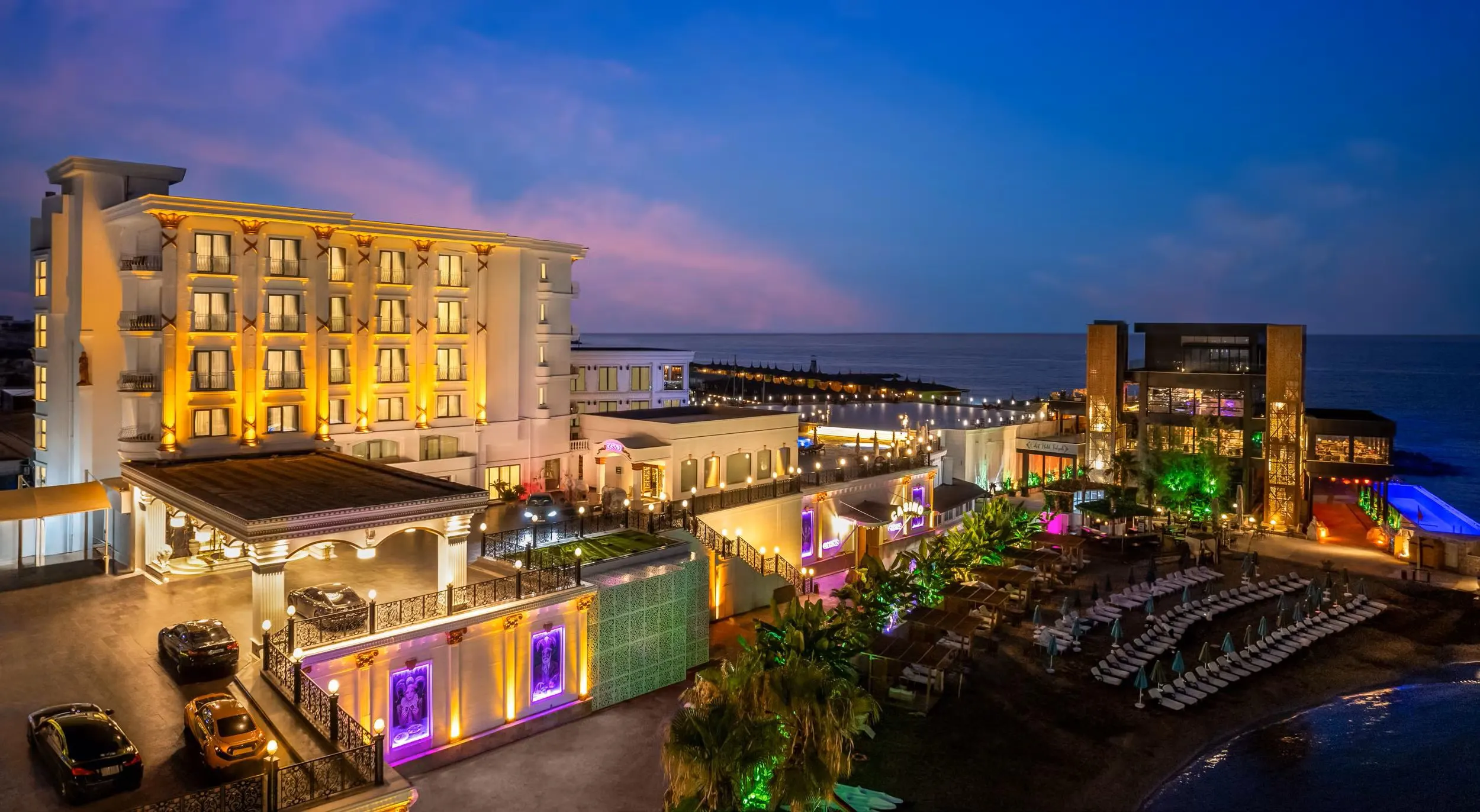 Luxury private taxi arriving at Les Ambassadeurs Hotel & Casino, a premier 5-star marina resort in Kyrenia, North Cyprus